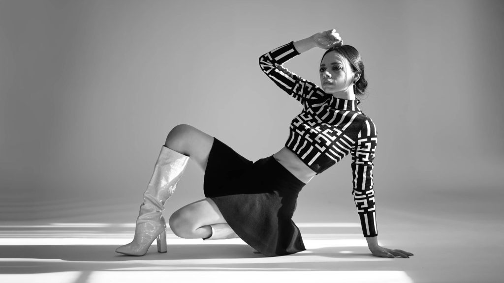 High-end fashion photography in Italy by Andrea Pol, featuring a stylish model posing in a designer outfit at milano fashion week